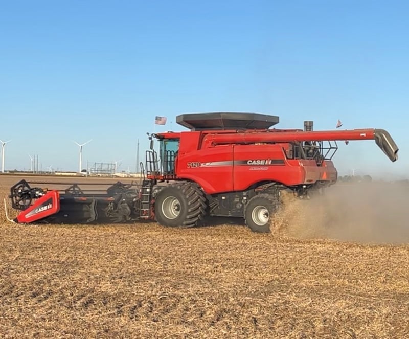 Case harvester working in a field